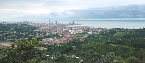Preview: Panorama of the city at the foot of the mountain. Travel in the mountains, holidays in the mountains