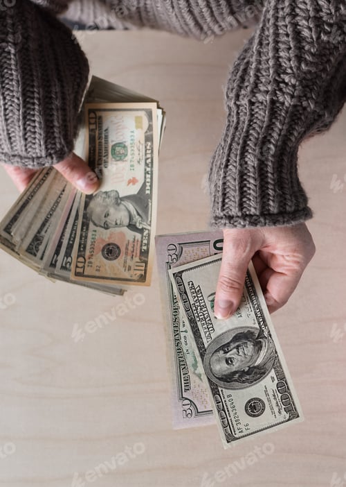 Preview: Female hands paying with cash money