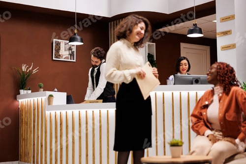 Preview: Male hotel worker answering phone call