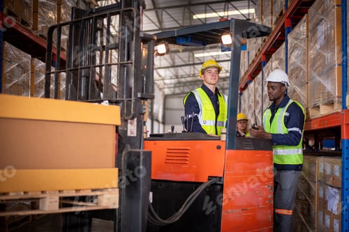Preview: Worker industry factory drive forklift truck moving goods boxes in warehouse industry production fac