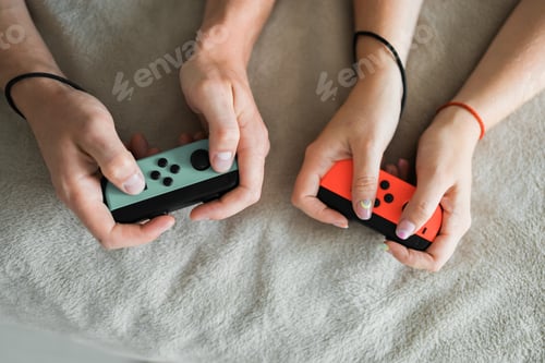 Preview: Hands using game controller. Playing video games