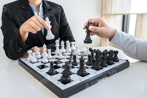 Preview: Businessman and businesswoman playing chess and thinking about strategy crash overthrow the opposite