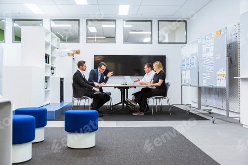 Preview: Business people having a meeting in conference room