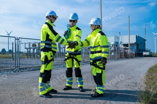 Preview: Engineers with equipment assessing wind farm site