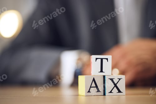 Preview: Business person, hands and blocks for tax, financial advisor or accounting on office desk. Letter o