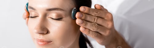 Preview: panoramic shot of healer standing near woman with closed eyes and using stones