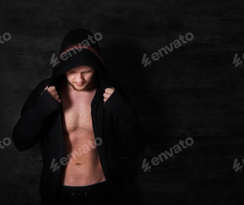 Preview: Handsome muscular male model near the wall