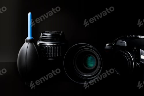 Preview: Camera lens and water filter on a black background. Close-up.