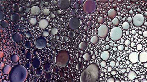 Preview: Abstract Colorful Food Oil Drops Bubbles and spheres Flowing on Water Surface