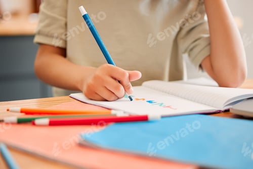 Preview: Student drawing picture in book, learning math and doing calculations in a notebook for education i
