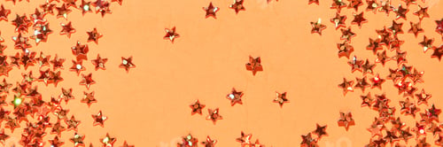 Preview: Sparkling gold star confetti on yellow background for festive and celebration