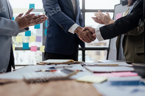 Preview: Business success. Business people handshake agreement confirmed in the investment business.