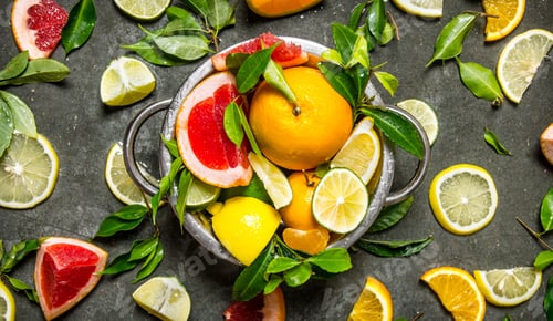 Preview: Citrus fruits - grapefruit, orange, tangerine, lemon, lime in a cup.