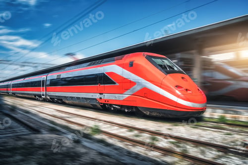 Preview: Red high speed train in motion on the railway station