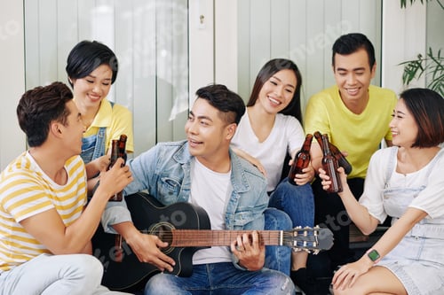 Preview: Young man singing for friends