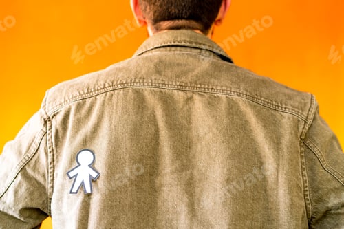 Preview: man with funny paper toy on jean jacket