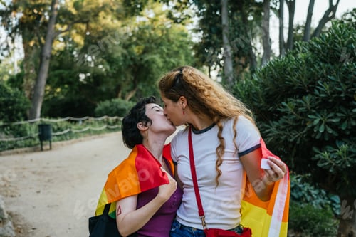 Preview: Lesbian couple kissing and showing their love at pride parade