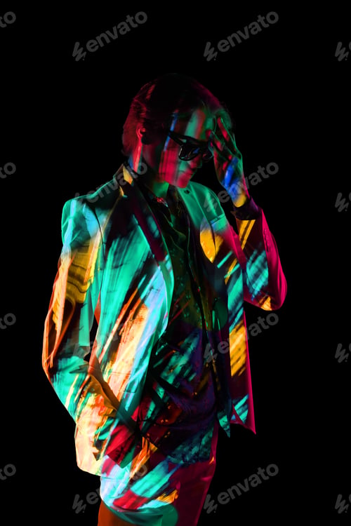 Preview: Androgynous man under bright illumination