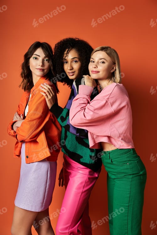 Preview: Harmony in hues: three multicultural women gracing orange aesthetic