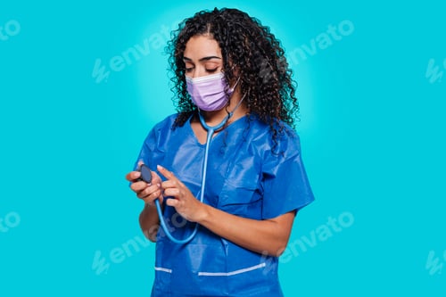 Preview: Young surgeon arabian woman testing the stethoscope