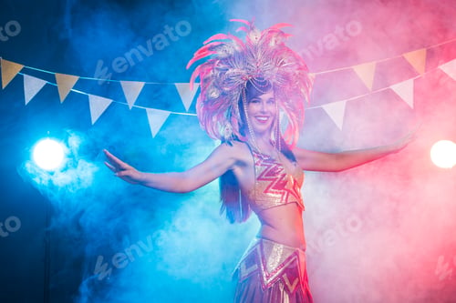 Preview: Carnival, belly dance and holiday concept - Beautiful female samba dancer wearing gold costume and