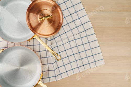 Preview: Copper frying pan on wooden background, top view