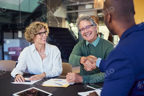 Preview: Businessman shaking hand after meeting with a new client
