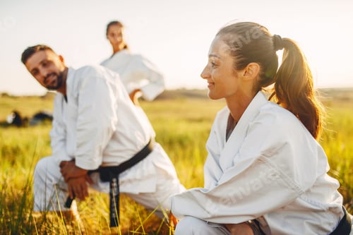 Preview: Two female karate with male instructor on training