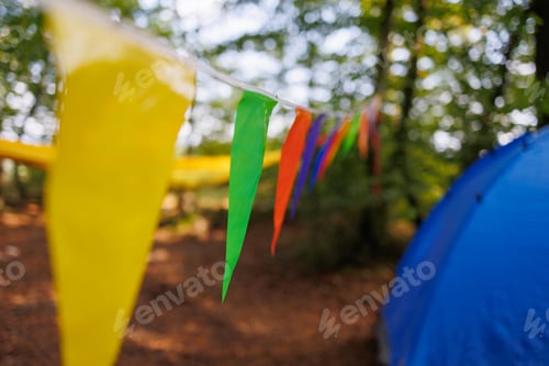 Preview: Carnival colorful garland flag, tent and hammock in forest camping
