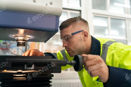 Preview: Engineer Man working at industrial robot in factory industrial. robotic and manufacturing operation.