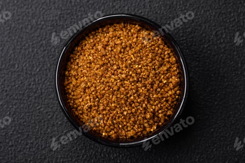 Preview: Crystals of brown Svan salt with spices in a black bowl
