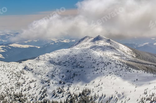Preview: Winter landscape panorama. Snow cowered mountains after snowfall.