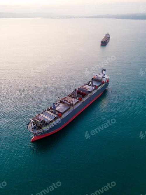 Preview: A massive cargo ship wood chips carrier in the sea, aerial view