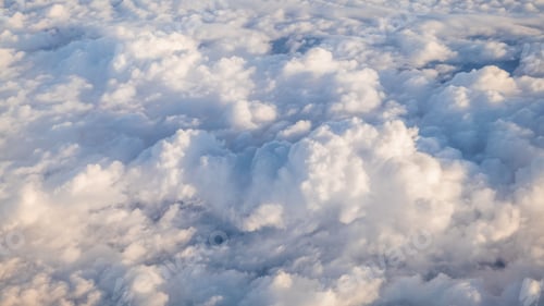 Preview: The beautiful cloudscape with clear blue sky. A view from airplane window.