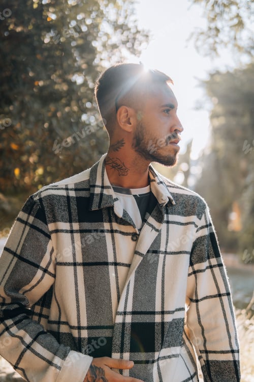 Preview: Man in Plaid Jacket Posing Outdoors