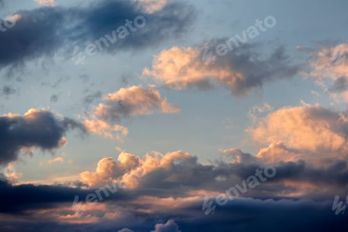 Preview: Dark cloudy sunset skies with an orange colored part, full frame background