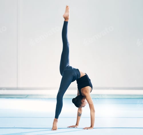 Preview: Gymnast, woman and cartwheel for training in gym, exercise and flexibility for mockup. Studio, perf