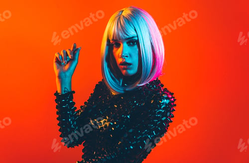 Preview: Young woman with grey wig dancing and celebrate. Colored gel portraits