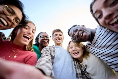 Preview: Portrait large group multiracial friends posing smiling and looking to camera. Happy young people