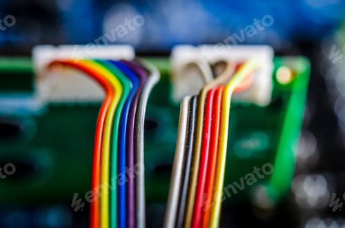 Preview: Visualizing data, color coded electrical wires are plugged into a computer printed circuit board