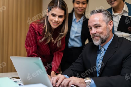Preview: Group of multi-Ethnic businessman and businesswoman working in office.