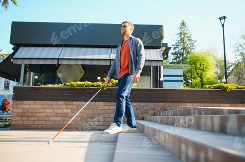 Preview: Blind Man Walking On Sidewalk Holding Stick