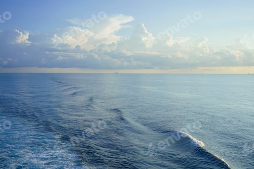 Preview: Ocean waves under a serene sky with distant ships on the horizon, South China Sea