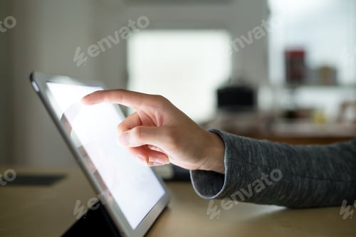 Preview: Hand presses on screen digital tablet