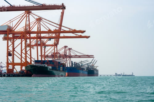 Preview: crane loading cargo container from truck to container ship in the international terminal