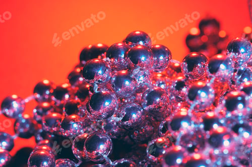 Preview: Party or holiday decoration concept - close up of silver shiny beads