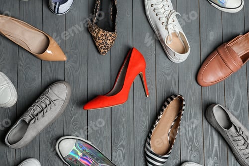 Preview: Flat lay composition with stylish shoes on wooden background