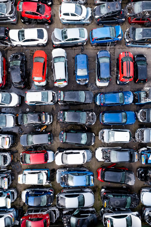 Preview: Full frame aerial view directly above rows of scrap metal cars