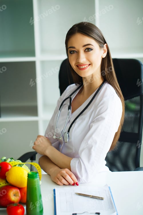 Preview: Health and Beauty. Portrait of a Happy Dietitian in the Light Room.