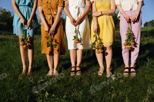 Preview: Womens diversity, Girl power, femininity concept. Group of five happy young women holding Roses